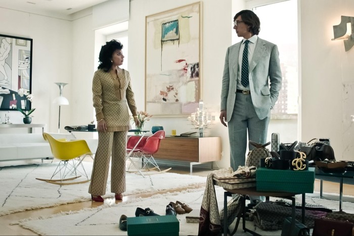 Lady Gaga and Adam Driver wearing 1970s clothes in a modernist salon in Ridley Scott’s ‘House of Gucci’