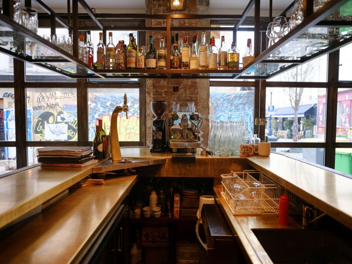 The bar at Le Grand Bain – graffiti can be seen through the window