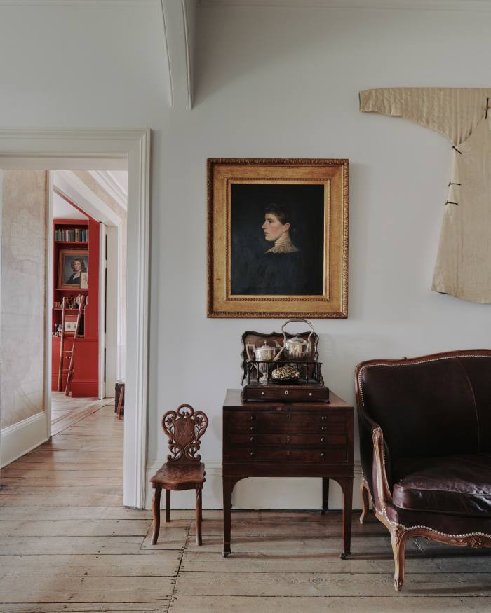 The front hall, where a portrait of an ancestor is juxtaposed with a 19th-century Chinese jacket