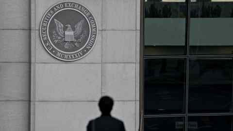 A pedestrian walks near the US Securities and Exchange Commission headquarters in Washington, DC
