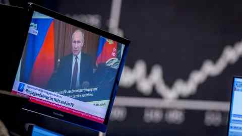 Russia’s president Vladimir Putin appears on a television screen at Frankfurt stock market last week
