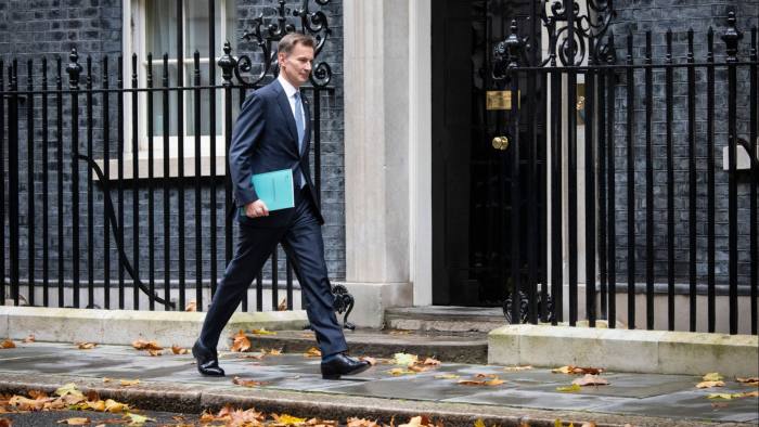 Chancellor Jeremy Hunt leaves Downing Street to deliver his Autumn Statement to MPs in the House of Commons, London