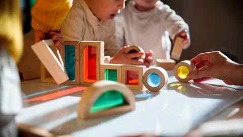 children playing with wooden toys