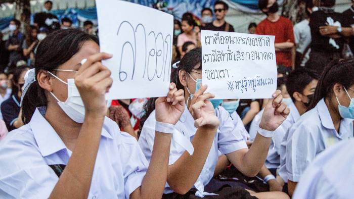 High school students protest outside the Ministry of Education in September with placards reading “Resign” and “We are the future of the nation. We shall have rights to choose our future.”