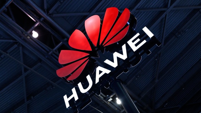 A lit-up logo of Huawei 