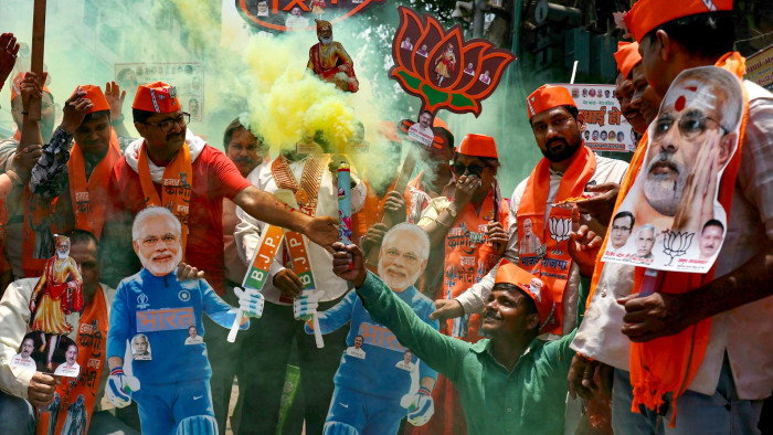 Supporters of Narendra Modi celebrate in Varanasi