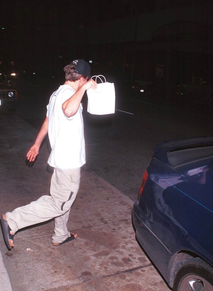 Leonardo DiCaprio leaves a restaurant in 1999