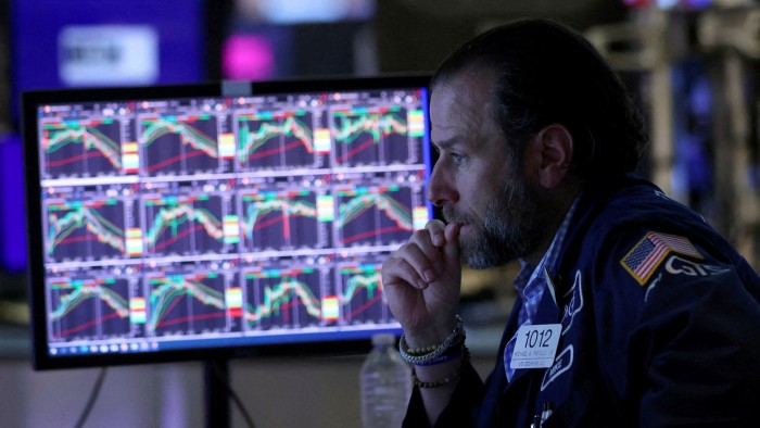  A trader works on the trading floor at the New York Stock Exchange