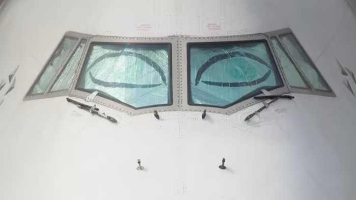 Illustration of an airline cockpit appearing to have sleepy eyes