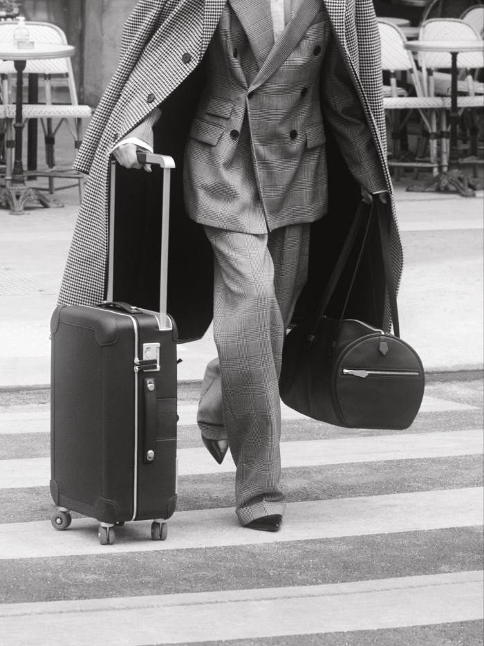 Ralph Lauren Collection wool coat, £2,255, cotton Elske jacket, £1,960, cotton Adrien BF shirt (just seen), £515, cotton Stamford trousers, £915, and Celia suede pumps, £460. Hermès leather Cabine 55 RMS suitcase, £7,320, and leather Galop d’Hermès Sport Swift bag, £4,830