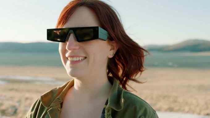 Woman wearing Snap’s AR glasses