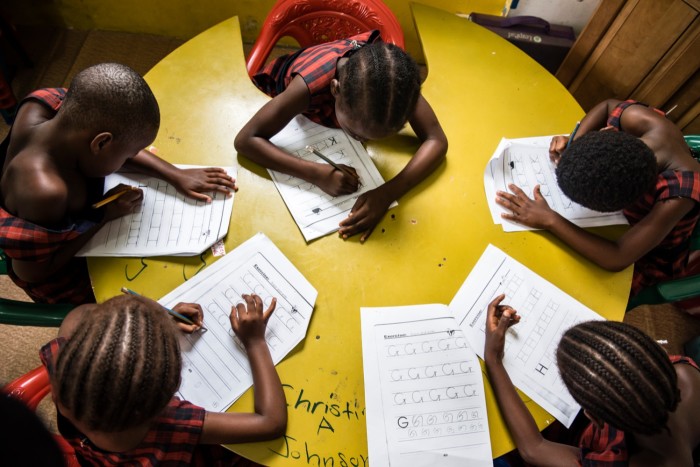 Everett’s photograph of children studying in Monrovia, Liberia
