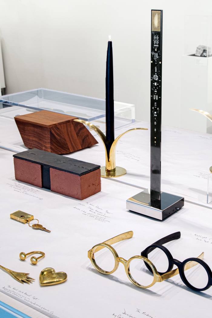 Pieces on sale at The Glass House including Bassam Fellows The Sharp Box, $310, The Brick House Box, $300, Skultuna The Lily candlesticks, $115, and The Modernist paperweight, $495