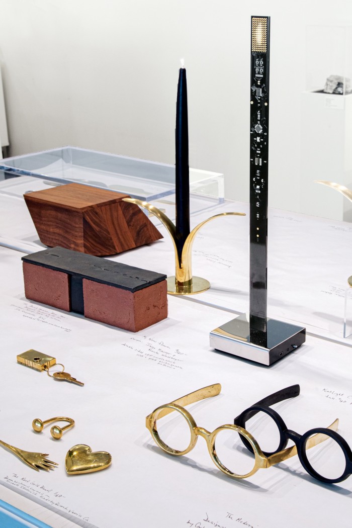 Pieces on sale at The Glass House including Bassam Fellows The Sharp Box, $310, The Brick House Box, $300, Skultuna The Lily candlesticks, $115, and The Modernist paperweight, $495