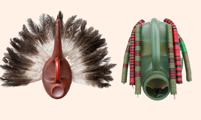 A photograph shows two masks, one shaped out of a red watering can and feathers; the other, realised with a green plastic tank and green, red and black objects