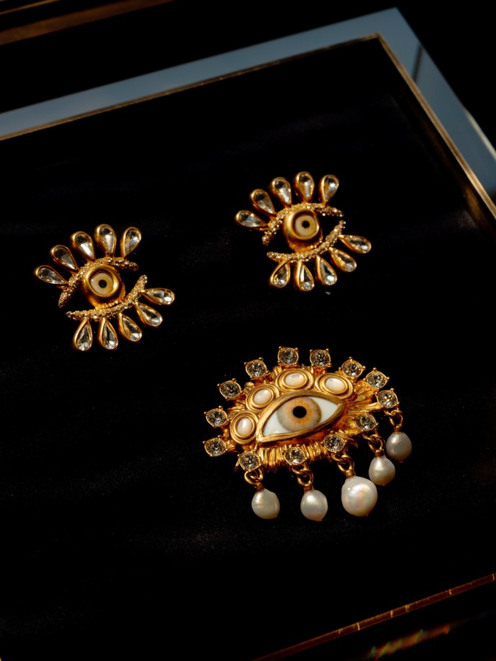 Gold eye earrings, €1,200, and eye brooch with pearls, €1,500