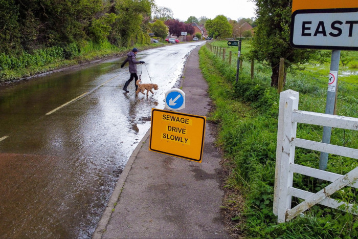 Flood surface water and sewage on the road in East Ilsley