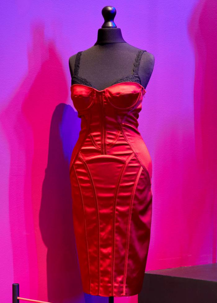 A tight red dress on a black mannequin
