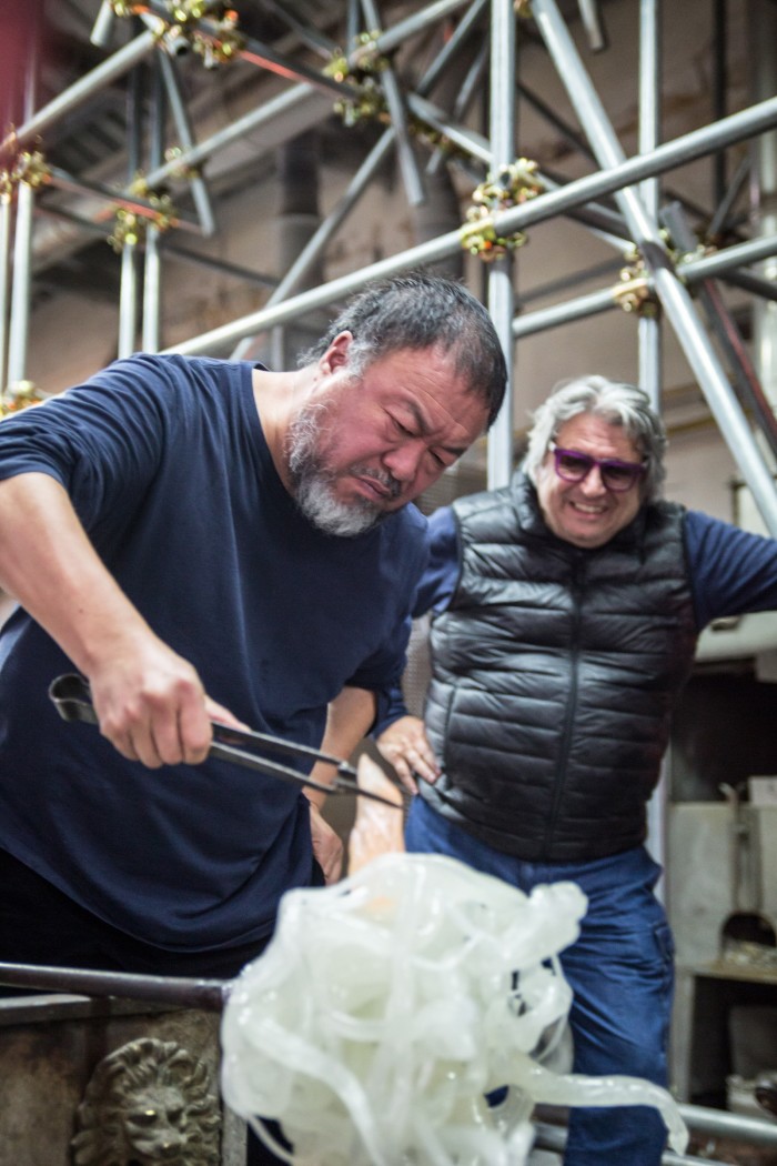 Ai Weiwei backstage at the 2017 Glasstress show, with (right) Adriano Berengo