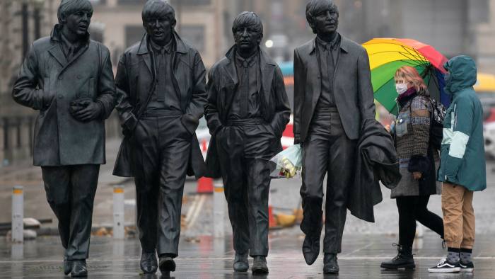 A statue of The Beatles in Liverpool. The city has been particularly badly hit by the pandemic, making it a logical choice for a new mass testing pilot