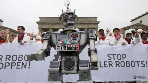 People take part in a demonstration as part of the campaign “Stop Killer Robots” organised by German NGO “Facing Finance” to ban what they call killer robots on March 21 2019 in Berlin
