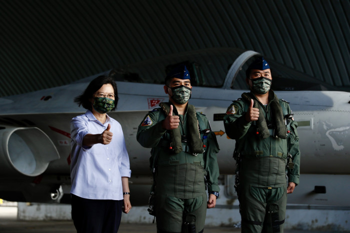 Taiwan’s President Tsai Ing-wen poses next to Air Force pilots during her visit to Penghu