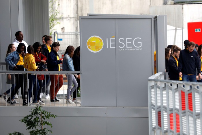  Students leave the IESEG School of Management building at La Defense business and financial district