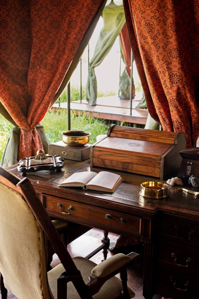 An antique writing desk in the main area at Jack’s Camp