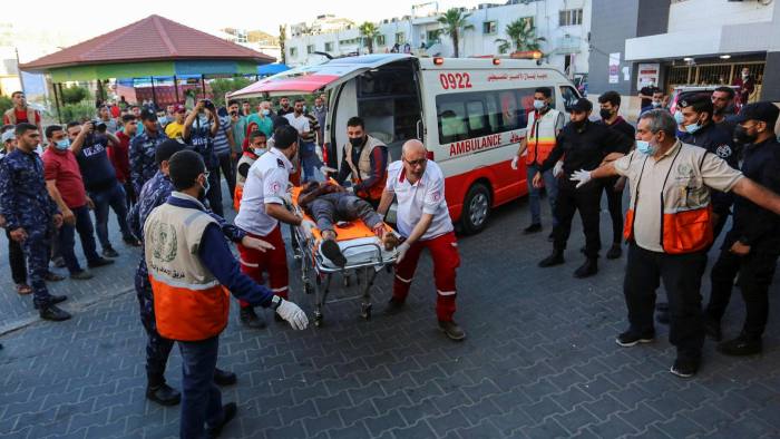 Ambulance workers bringing in a patient to a hospital