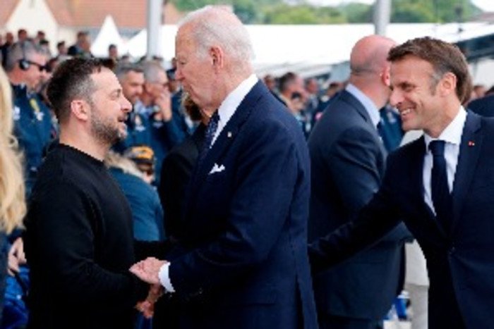US President Joe Biden and Ukrainian President Volodymyr Zelenskyy shake hands at the D-Day ceremonies in France