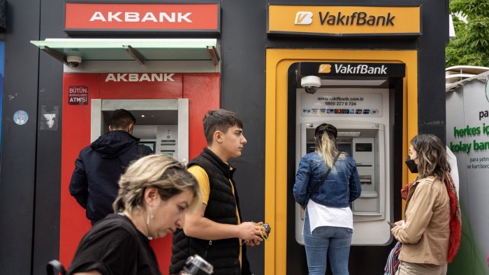 Customers use cash machines in Ankara, Turkey 