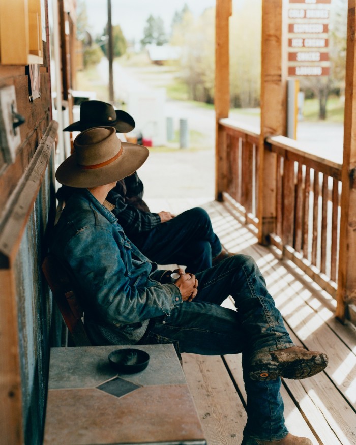 Locals on a porch in the Montana town of Ovando