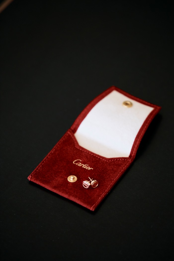 Her rose-gold Cartier earrings