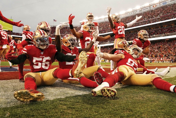 The San Francisco 49ers celebrate a defensive play during a 2020 game