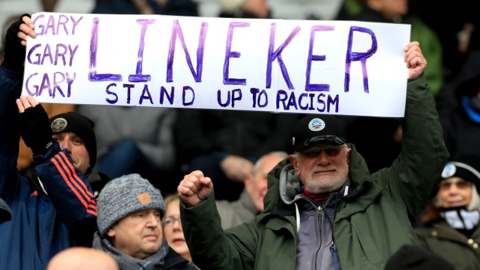 Swansea City fans hold up a sign in support of Gary Lineker ahead of the football team’s Championship match on Saturday