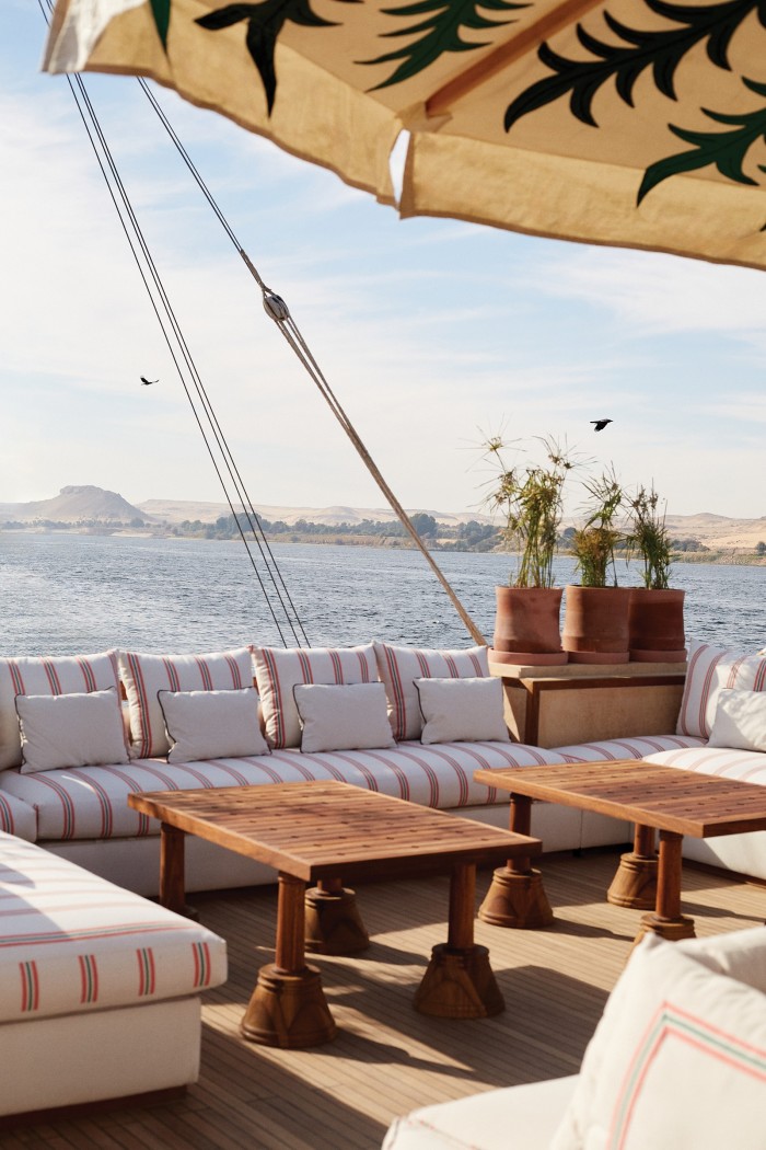 On the deck of the Yalla Nile, styled as a traditional dahabiya riverboat
