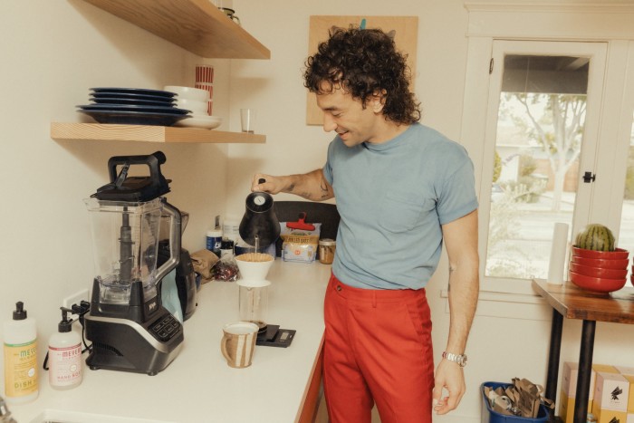 The musician makes coffee in his LA home