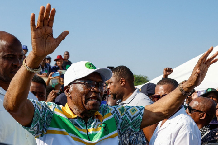 Jacob Zuma gestures after voting during the South African election 