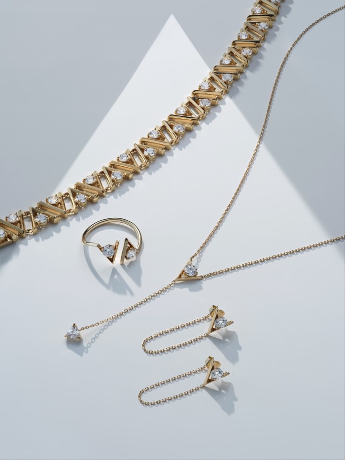 From top: Vrai gold V Tennis choker, £13,917, gold V Cuff ring, £878, gold V Duo Round Brilliant and Trillion Lariat necklace, £981, and gold V Linked earring, £826