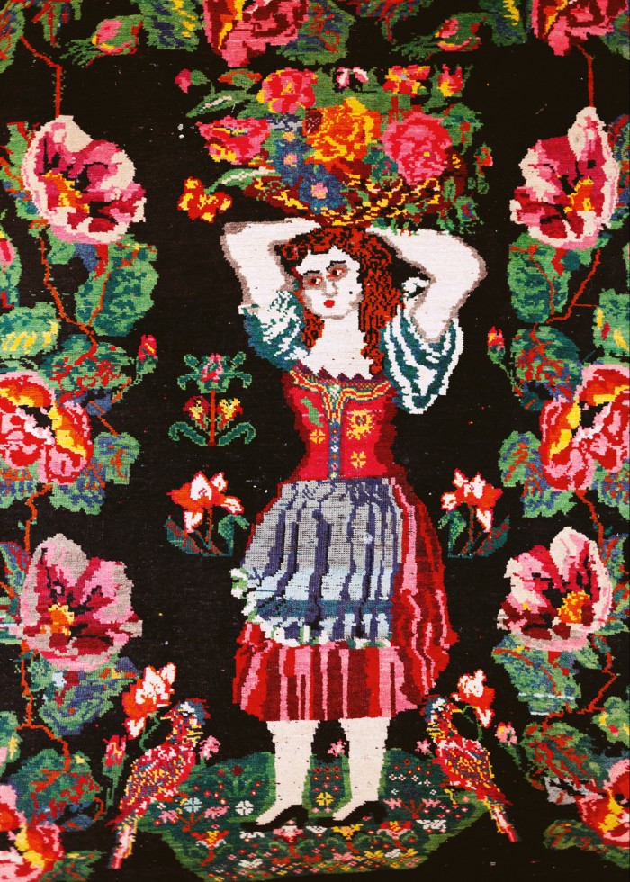 His carpet from Aleppo, with the folk-art girl he calls Villanelle