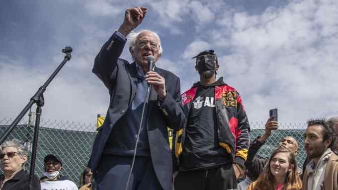 Senator Bernie Sanders speaks next to Christian Smalls, founder of the Amazon Labor Union during a rally in the Staten Island borough of New York