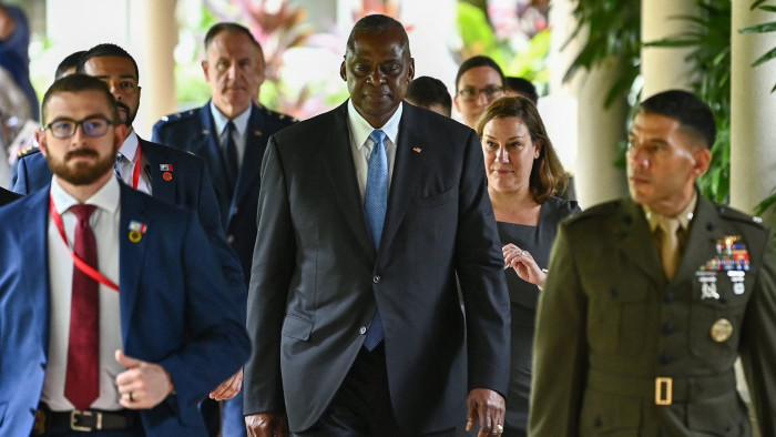 US defence secretary Lloyd Austin, centre, walks with US officials in Singapore 