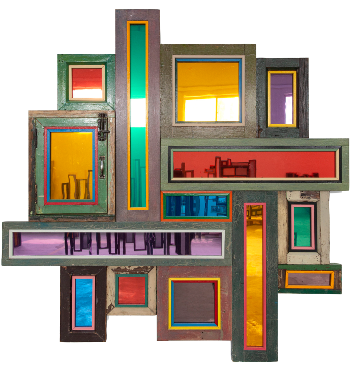 An artwork made up of a series of connected rectangular wooden frames with colourful panes that look like reflective windows