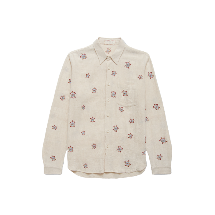 A long sleeve white shirt with turtle patterns