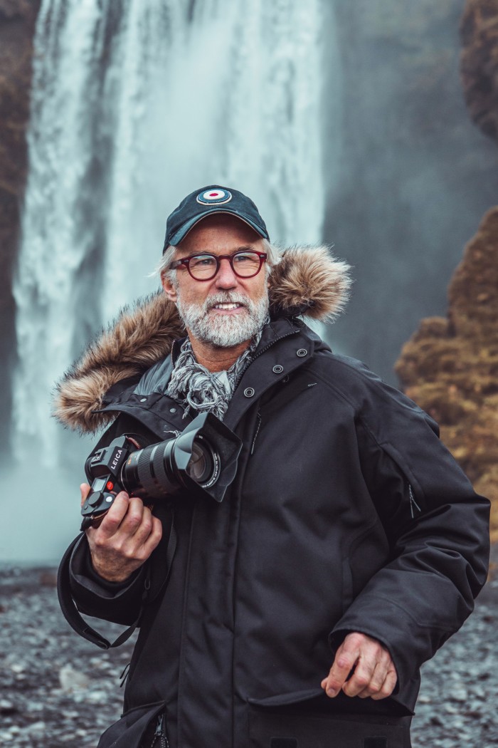 Ragnar Axelsson at Skogafoss waterfall, Iceland, 2019