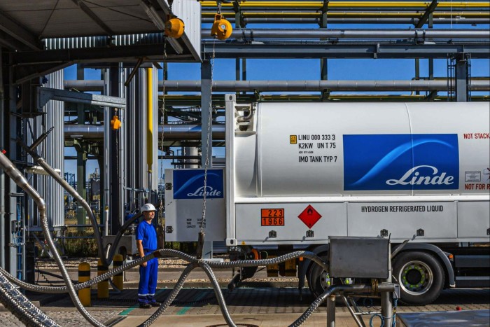 The Linde AG logo sits on a liquid hydrogen tanker truck taking a fuel delivery at the Linde hydrogen plant in Leuna, Germany