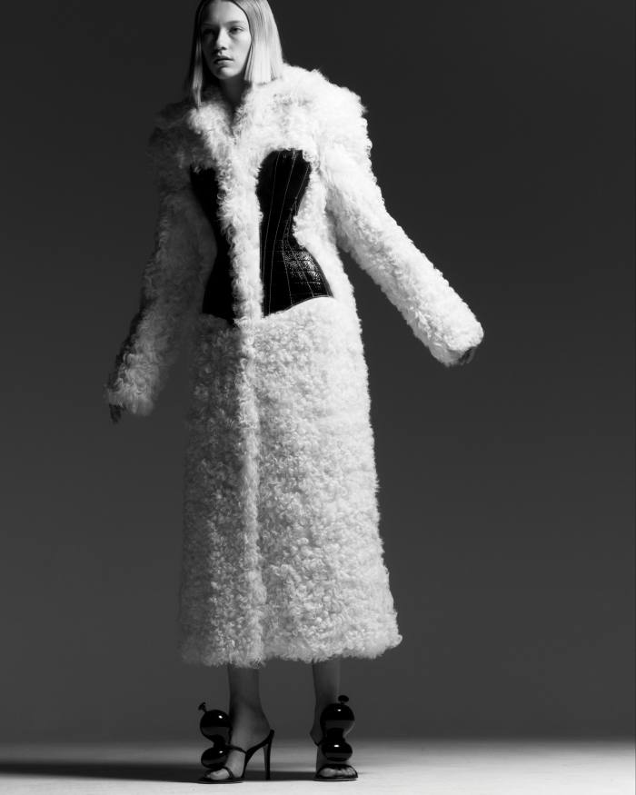 Schiaparelli shearling reversible coat with crinkled and glazed leather bustier, €19,000. Loewe leather Balloon sandals, £895