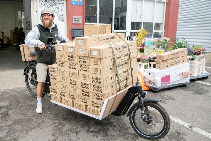 Freddie’s Flowers rider Charlie Hill on his delivery bike full of boxes