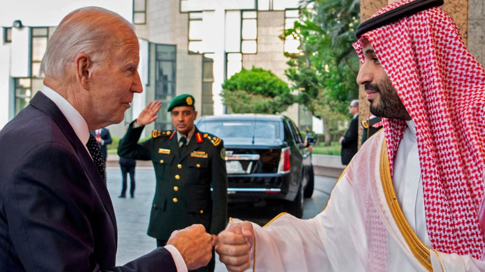 Saudi Crown Prince Mohammed bin Salman, right, bumps fists with US President Joe Biden