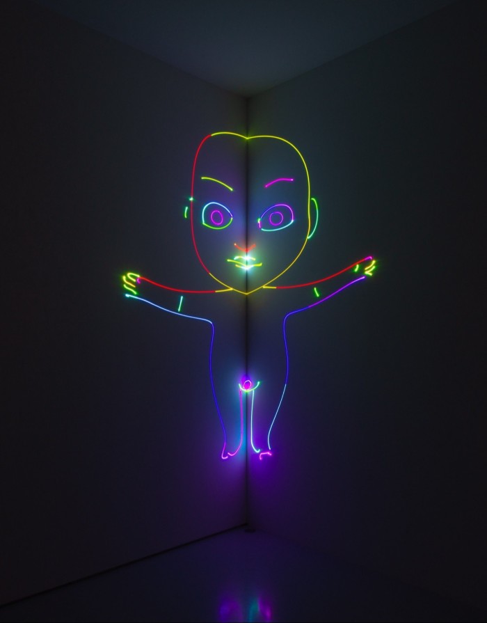 Light sculpture of a baby outlined in different colours